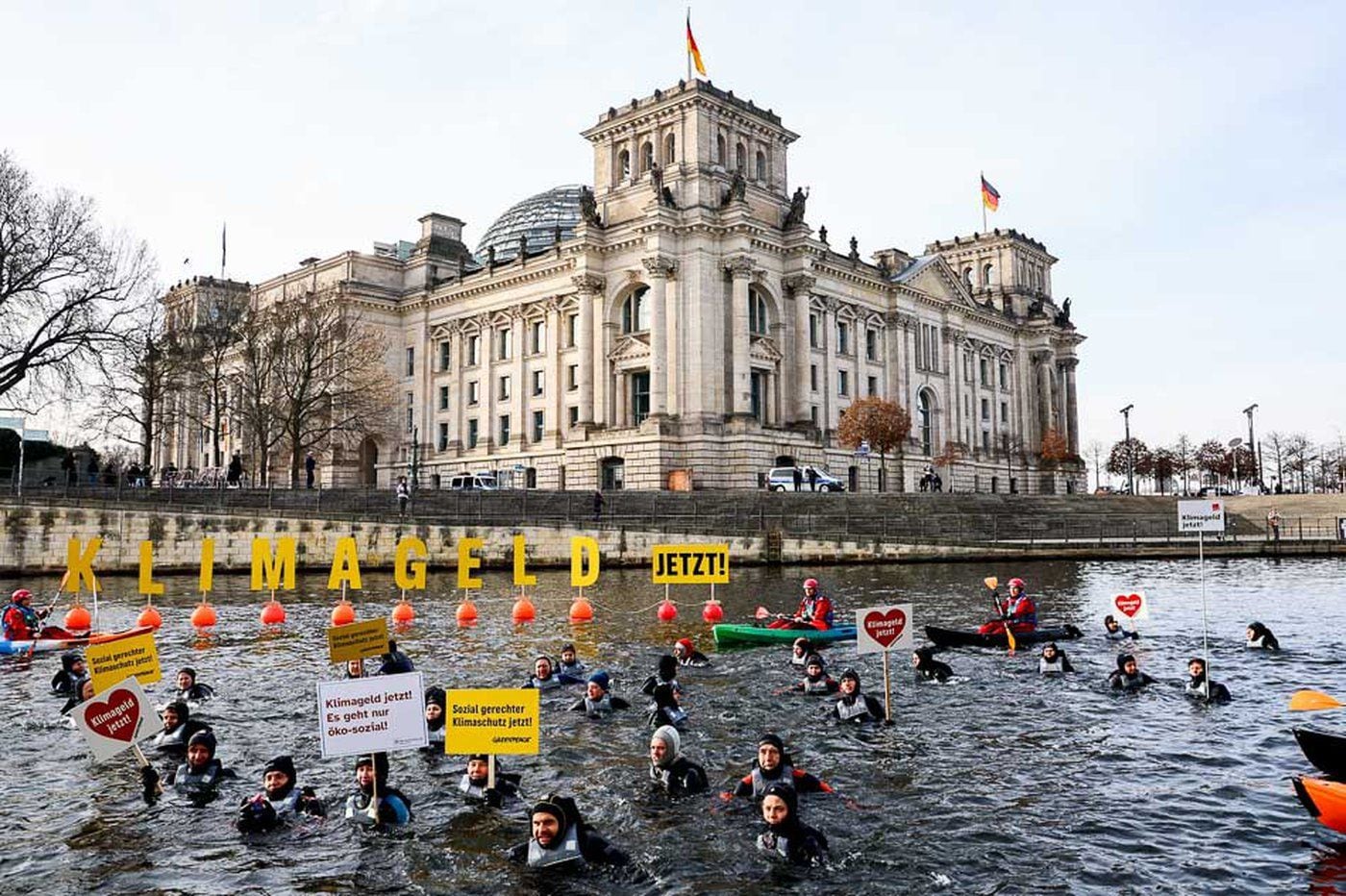 Activists swim for climate money